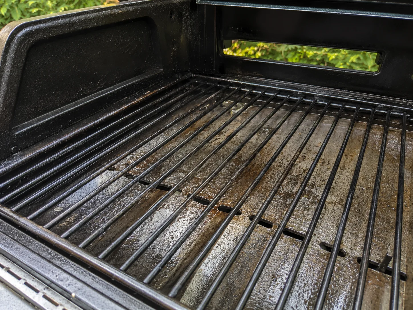 Open grill interior inspected before repair