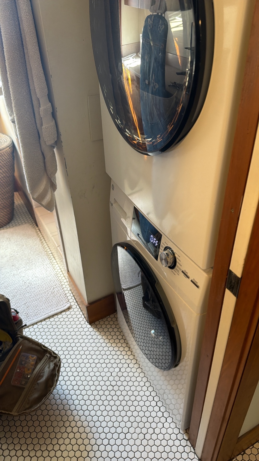 Stacked laundry unit tested after dryer repair is complete